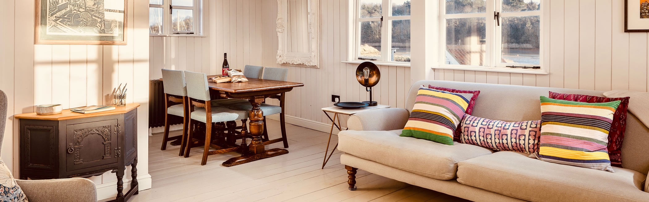 room with sofa, dining table and armchair